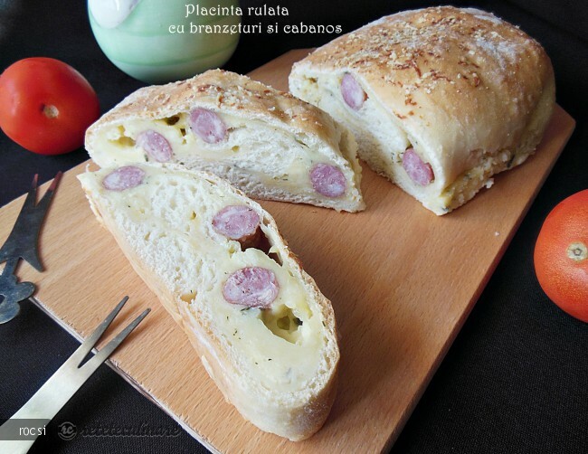 Imagine Reteta culinara Placinta rulata cu branzeturi si cabanos | 2review.ro