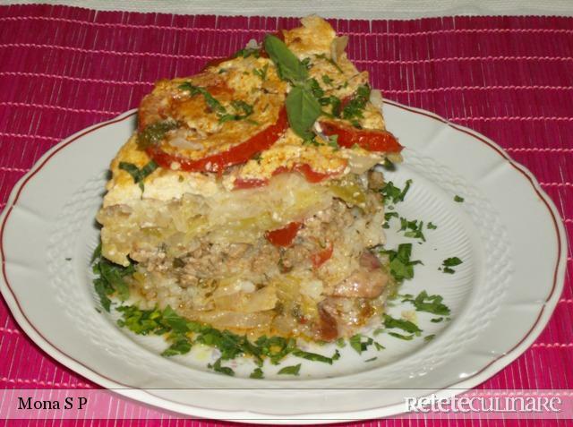 Imagine Reteta culinara Varza cu orez si carnati la cuptor | 2review.ro