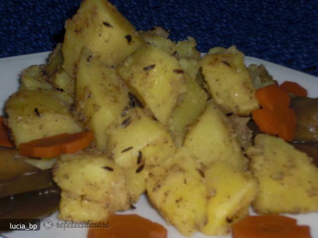 Imagine Reteta culinara Cartofi cu Sos Garam Masala si Nigella | 2review.ro